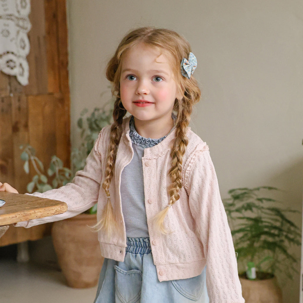 Child wearing Puella Flo Teddy Knot Hair Clip in Blue