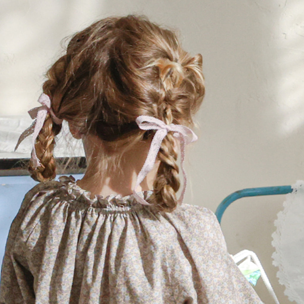 Child wearing Puella Flo Jen Floral Hair Pin in Pink