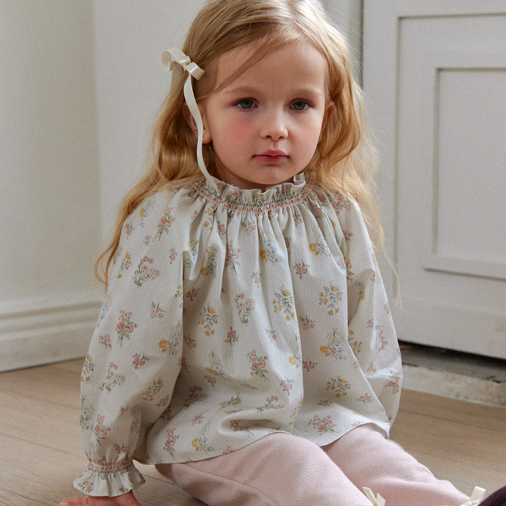 Child wearing ROA Smocked Floral Print Blouse in Floral