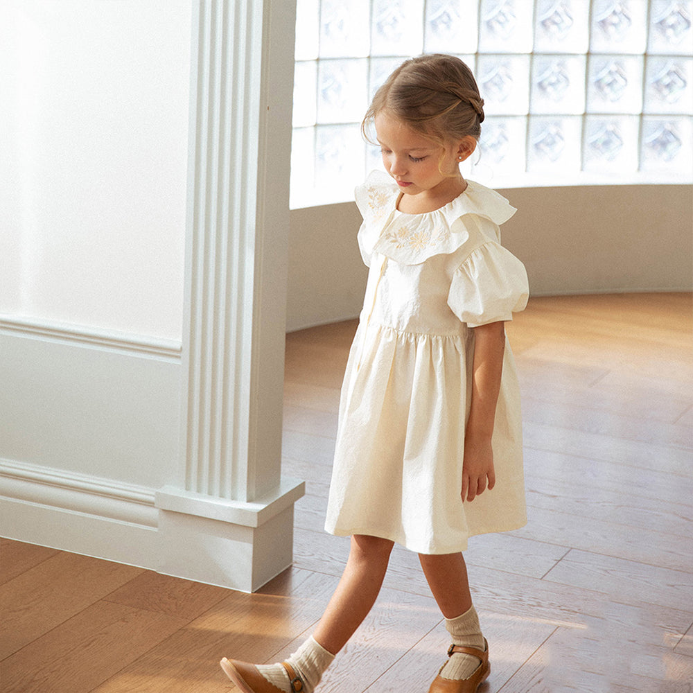 Child wearing NOU NOU Flower Jeanne Pleated Midi Dress in Cream
