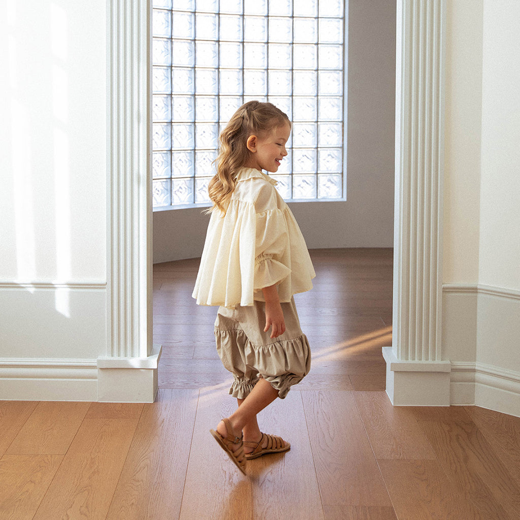 Child wearing NOU NOU Silky Petal Flounce Blouse in Gold