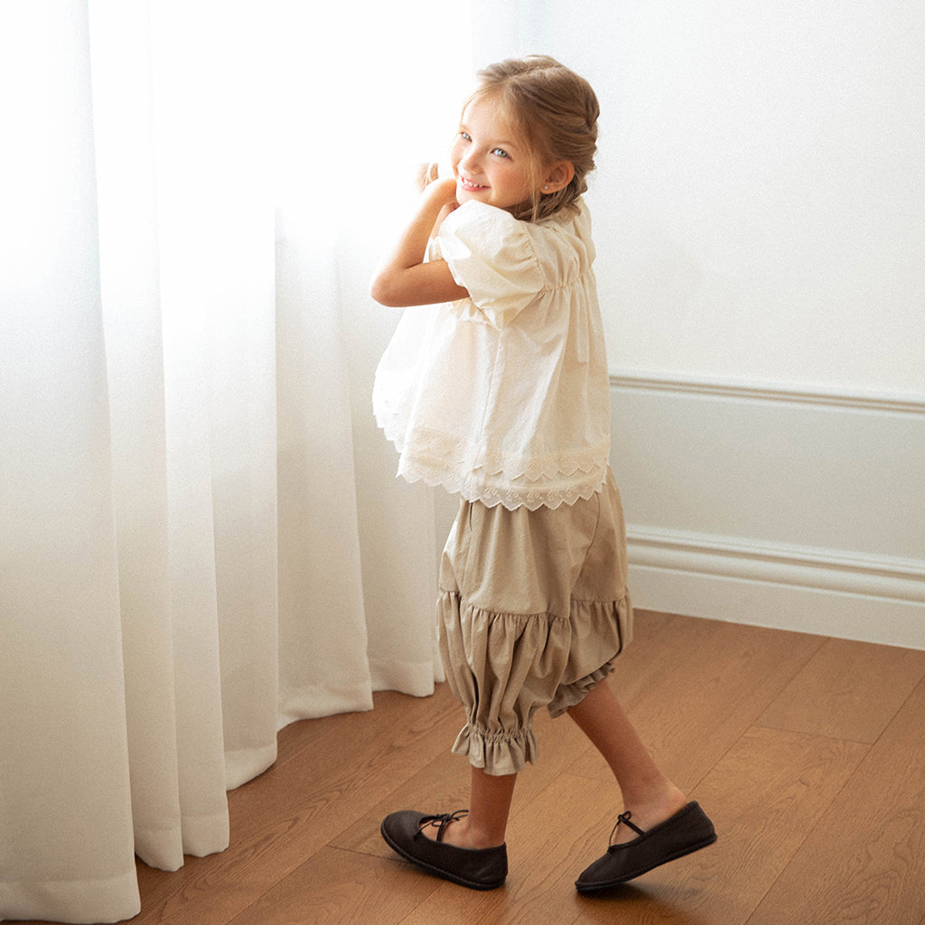 Child wearing NOU NOU Judy Wide-Leg Cotton Pants in Khaki Beige