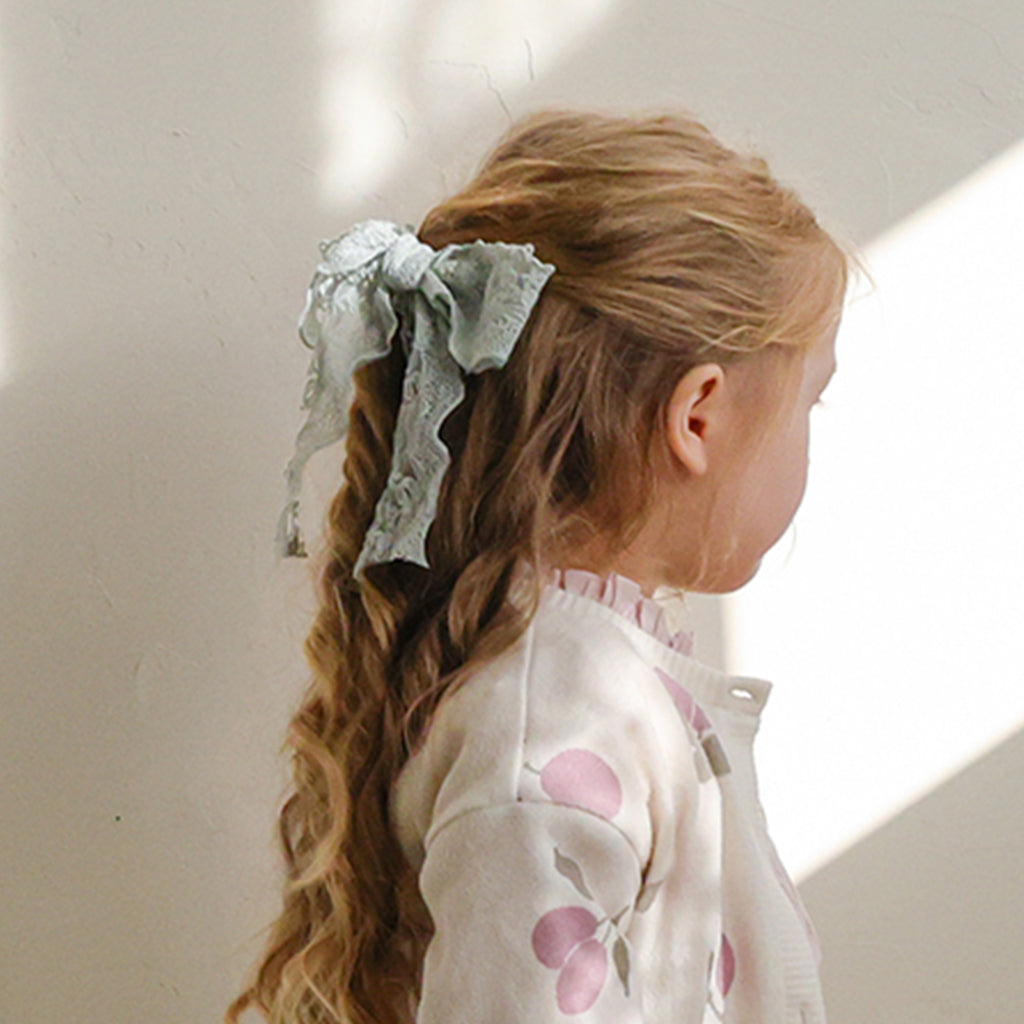 Child wearing Puella Flo Madeline Ribbon Hair Clip in Mint