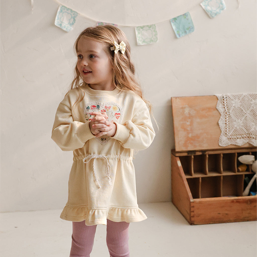 Child wearing Puella Flo Teddy Knot Hair Clip in Yellow