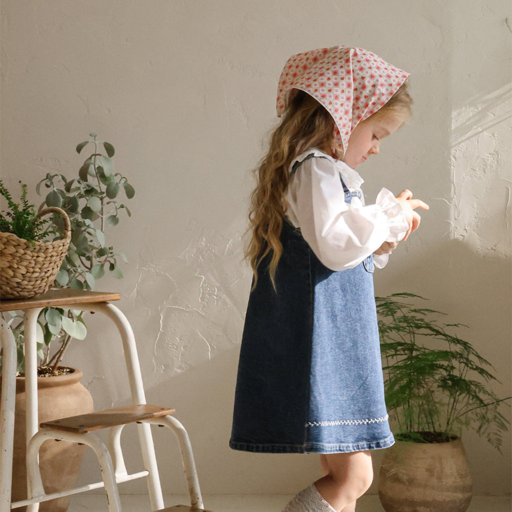 Child wearing Puella Flo Arona Scarf Pattern A in Pink