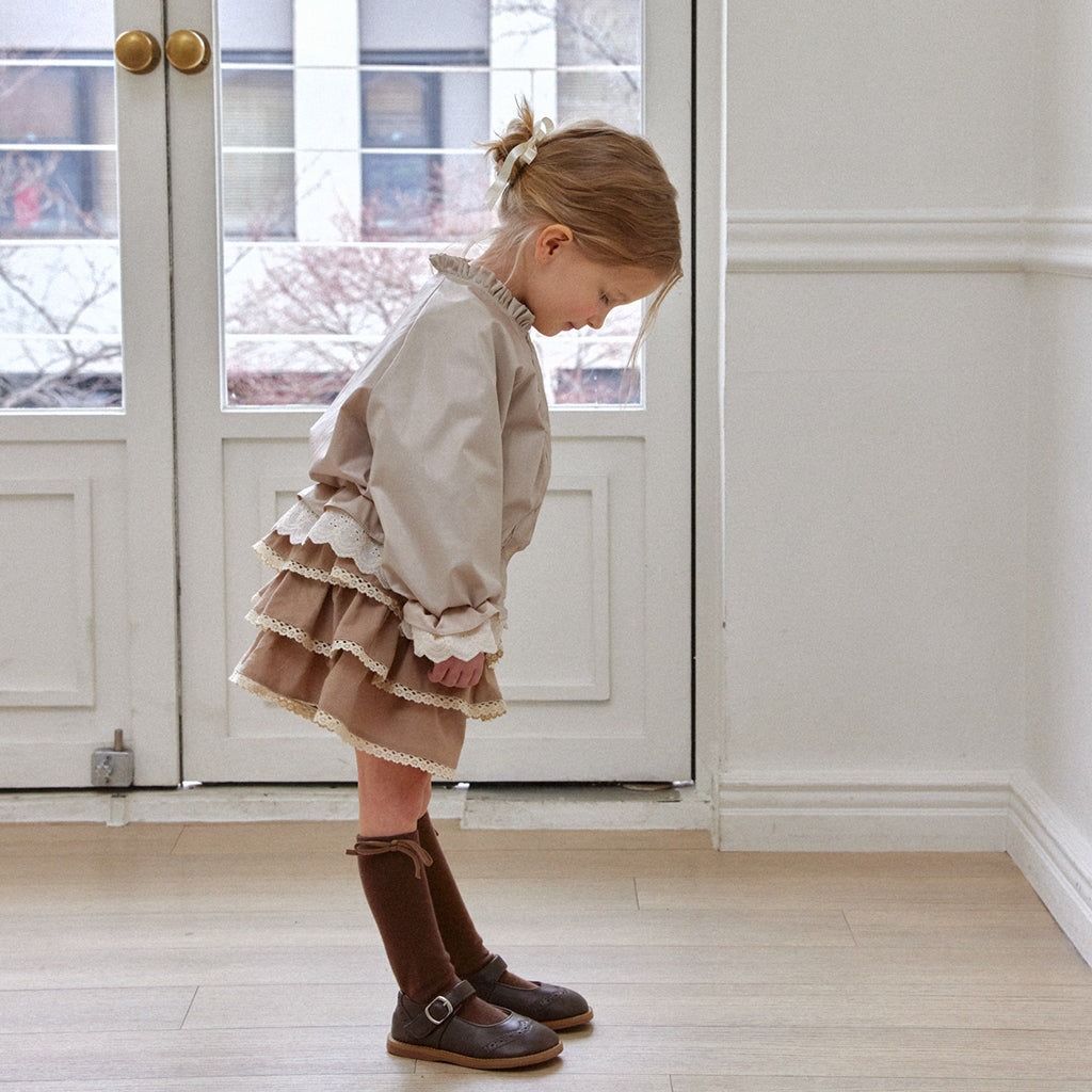 Child wearing ROA Ruffle Trim Windbreaker Jacket in Beige